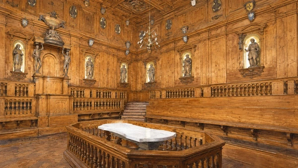 Watercolour: Archiginnasio Anatomical Theatre, timber benches and carved statues surrounding a white marble table